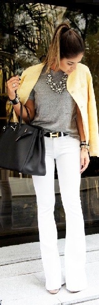 Sophisticated day style: Statement necklace, yellow jacket, white trousers, and Hermes belt.